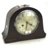 A 20th century mantle clock, the silvered dial with Arabic numerals,