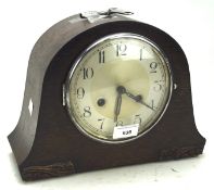 A 20th century mantle clock, the silvered dial with Arabic numerals,