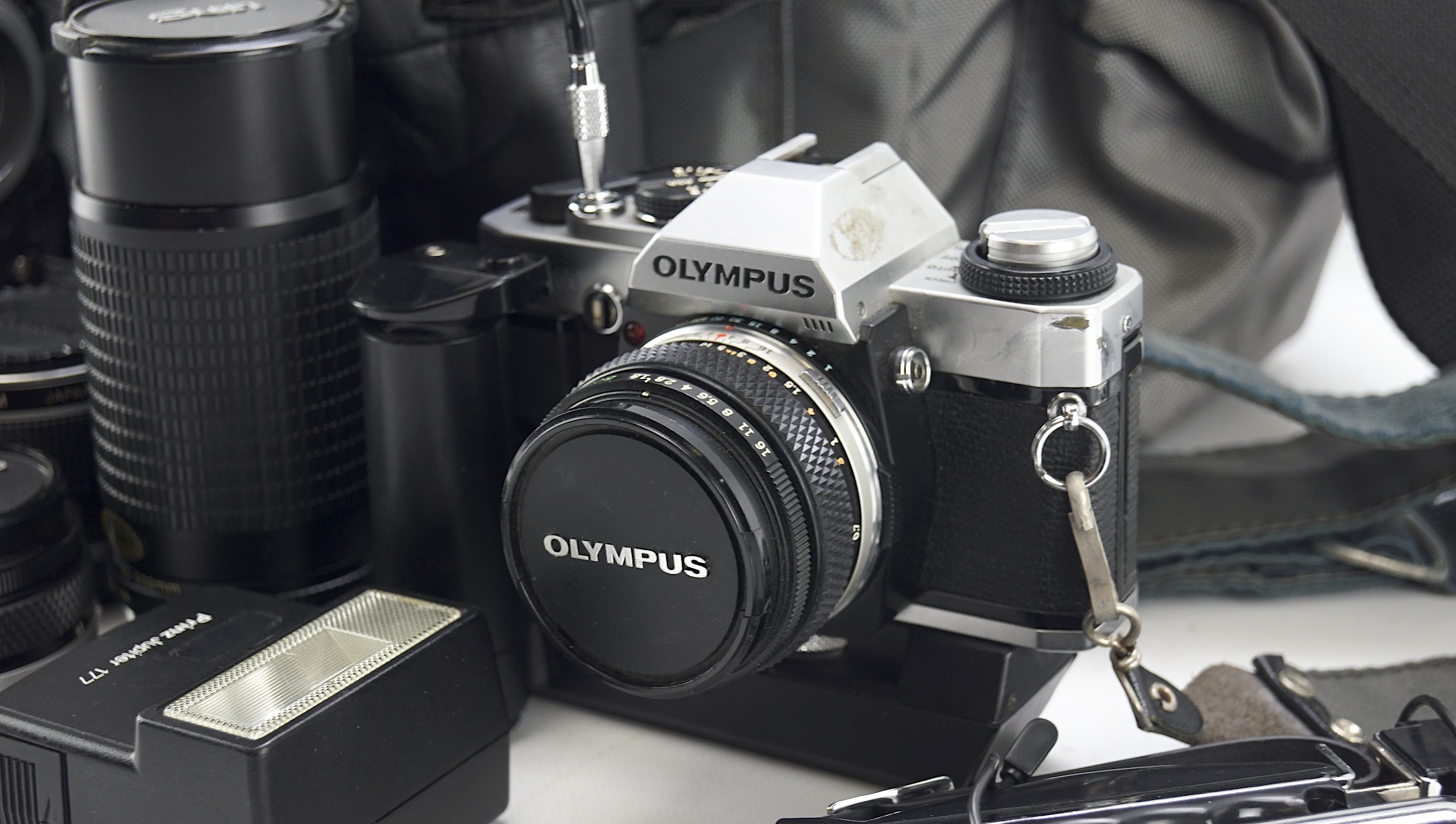 Assortment of cameras and lenses including an Olympus camera and accessories - Image 2 of 4
