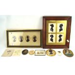 A collection of silhouettes, including two framed sets of four,