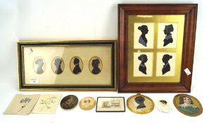 A collection of silhouettes, including two framed sets of four,