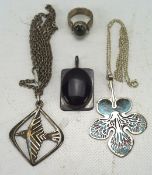 Three contemporary silver pendants and a textured shank seaweed agate dress ring, combined weight,