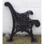 Two cast metal bench ends, with pierced floral decoration,