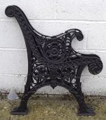 Two cast metal bench ends, with pierced floral decoration,