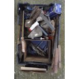 A collection of vintage tools, including saws, wrenches,