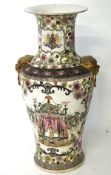 A large Oriental vase, of baluster shape with a flared rim, decorated with flowers,