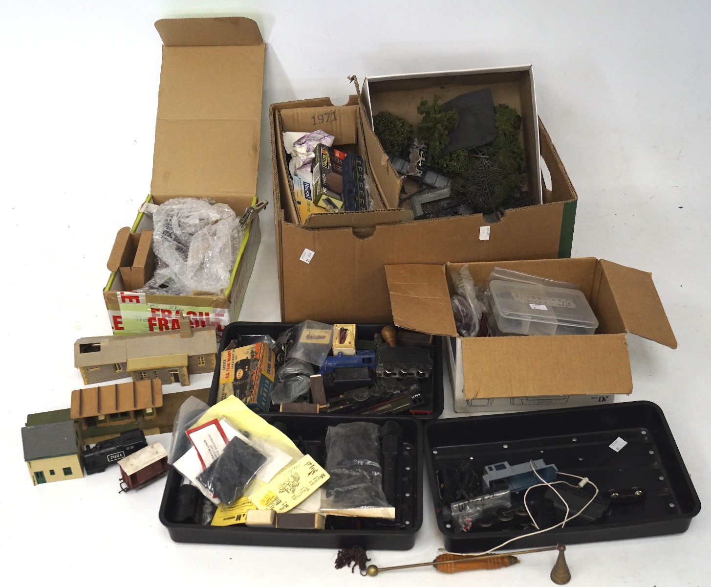 A collection of model railway related wares, including coaches, foliage, buildings,