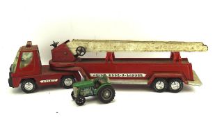 A vintage red Nylint aerial hook-n-ladder metal toy fire engine, 77cm long,