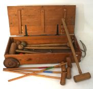 A vintage wooden croquet set, including adult and child's set, in original wooden box,
