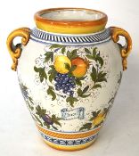 An unusually large Italian painted terracotta twin handled vase,