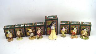 A Royal Doulton ceramic set of Snow White and the seven drawfs, each with original box,