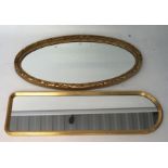 Two gilt framed wall mirrors, one being of oval form, the other a hall mirror,