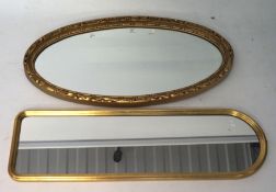 Two gilt framed wall mirrors, one being of oval form, the other a hall mirror,