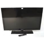 A Samsung flat screen TV, model LE40C530F1WXXU, with controller,