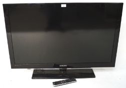 A Samsung flat screen TV, model LE40C530F1WXXU, with controller,