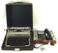 A vintage typewriter and Spirit of St Louis telephone,