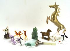 A collection of assorted glass and ceramic animal figures, including a figures of cats,