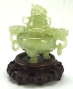 A 20th century quartz lidded censor on wooden stand, with dragon twin ring handles, on wooden stand,
