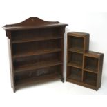 Two 20th century bookshelves, one being mahogany, the other being oak, the larger with four tiers,