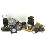 A selection of vintage bicycle lamps and car gauges,