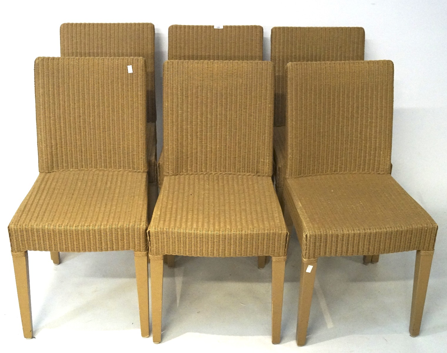 Six Lloyd Loom style chairs by Vincent Sheppard, on tapered supports,