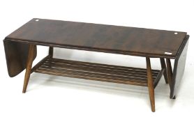 A stained darkwood Ercol coffee table, with drop leaf to each end, on turned supports,