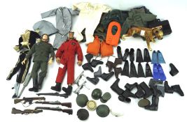 Two vintage Action Man figures and an assortment of clothing and accessories, including a dog,