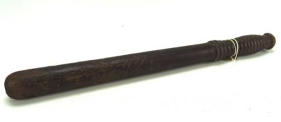 A 19th century wooden truncheon, marked M P under crown, 42.