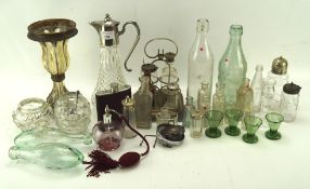 A silver rimmed claret jug together with a collection of glassware, including vintage bottles,