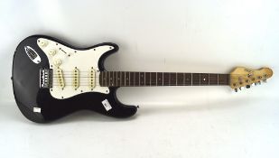 A left handed Encore electric guitar, in black and white,