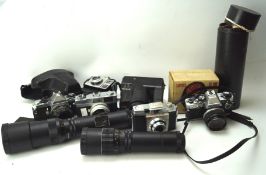 A collection of cameras, including a Canon K45079, a Pentax 'ME Super', Olympus OM10 and more,