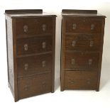 A pair of early 20th century stained wooden chests of drawers, each having four drawers,