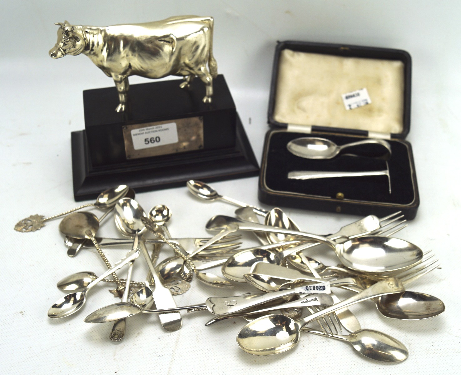A collection of 19th and 20th century silver and silver plated flatware, including spoons and forks,