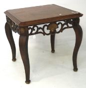 A 20th century wooden topped coffee table, mounted on ornate metal base,