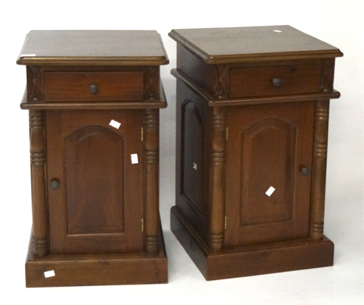 A pair of stained wooden bedside cabinets, both with a single door with a drawer above 65.