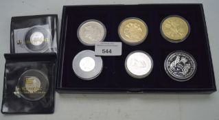 A selection of proof coins, to include a £5 silver "one small step 2009" moon landing coin,
