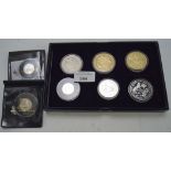 A selection of proof coins, to include a £5 silver "one small step 2009" moon landing coin,