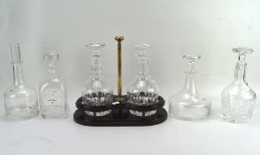 Two Stuart cut glass decanters on stand,