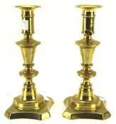A pair of late 19th century Barlow adjustable brass candlesticks,
