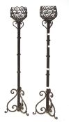 A pair of ecclesiastical candle stands,