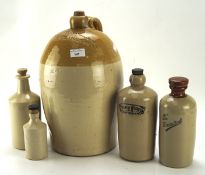 A collection of stoneware containers, including one branded '2 Bond, wine and spirit merchant,