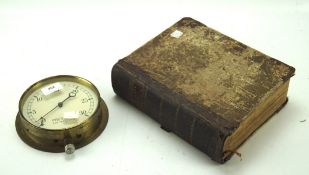 An early 19th century book and a brass housed pressure gauge,