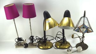 A collection of five table lamps, to include two adjustable desk lamps,