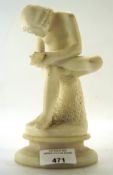 A 20th century carved Alabaster sculpture depicting a seated man with a thorn in foot, 18.