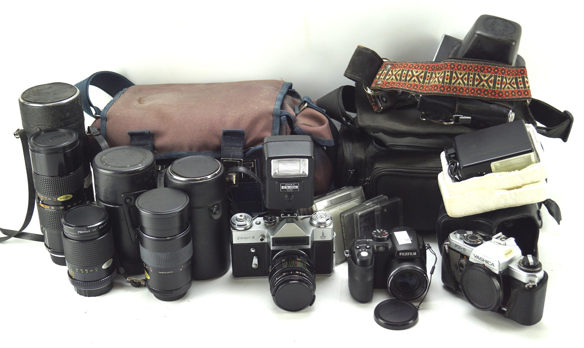 A collection of cameras, lenses and related accesories, to include a Fujifilm 10 mega pixel,