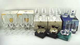 A collection of boxed glasses and coasters, including Bohemian and crystal examples, by Dartington,