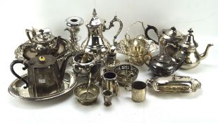 A collection of silver plate, including teapots, trays, a coaster and more,