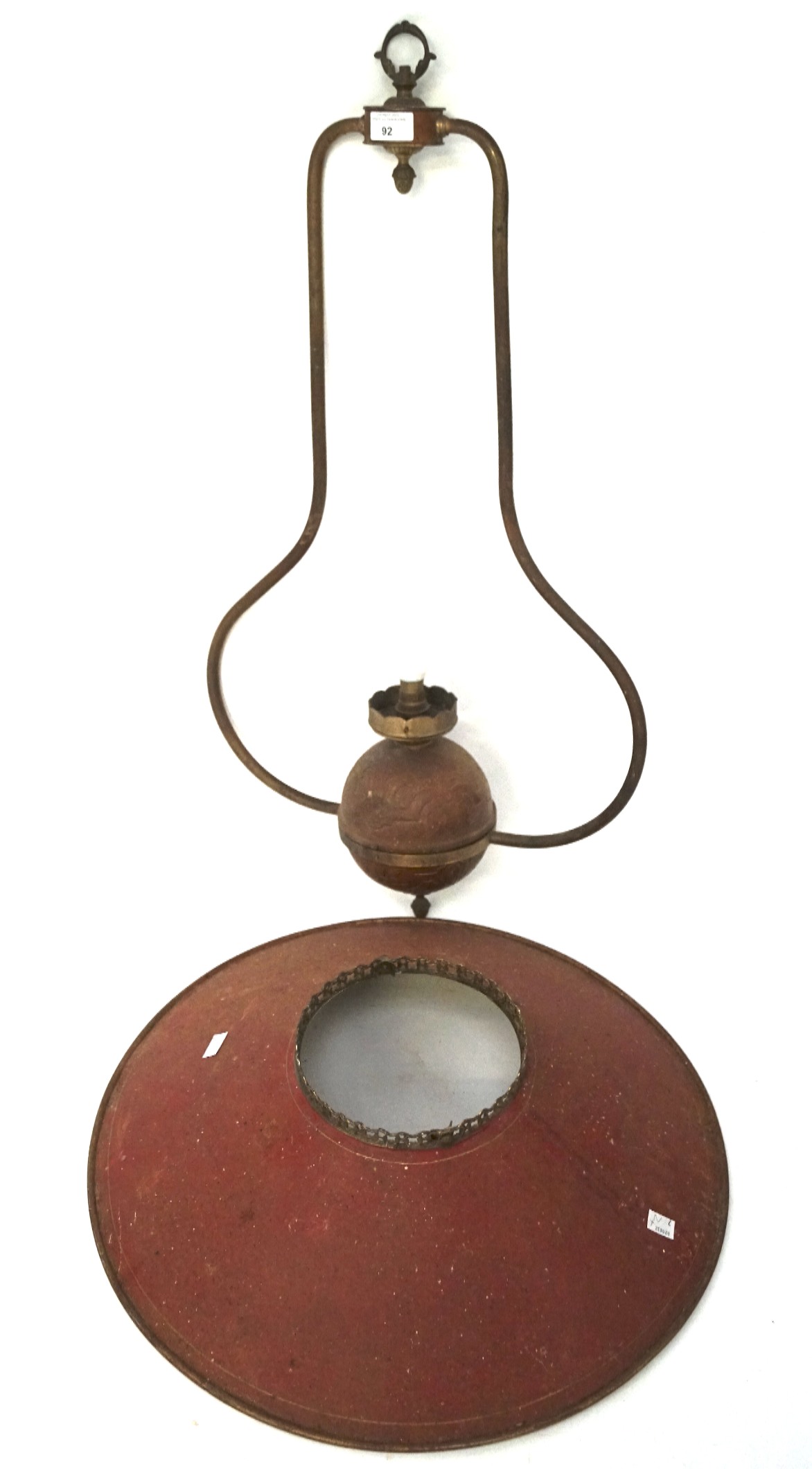 A large cast metal celing light with lamp shade, the frame with embossed details,