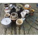 A collection of assorted plant pots, most being ceramic,