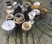 A collection of assorted plant pots, most being ceramic,